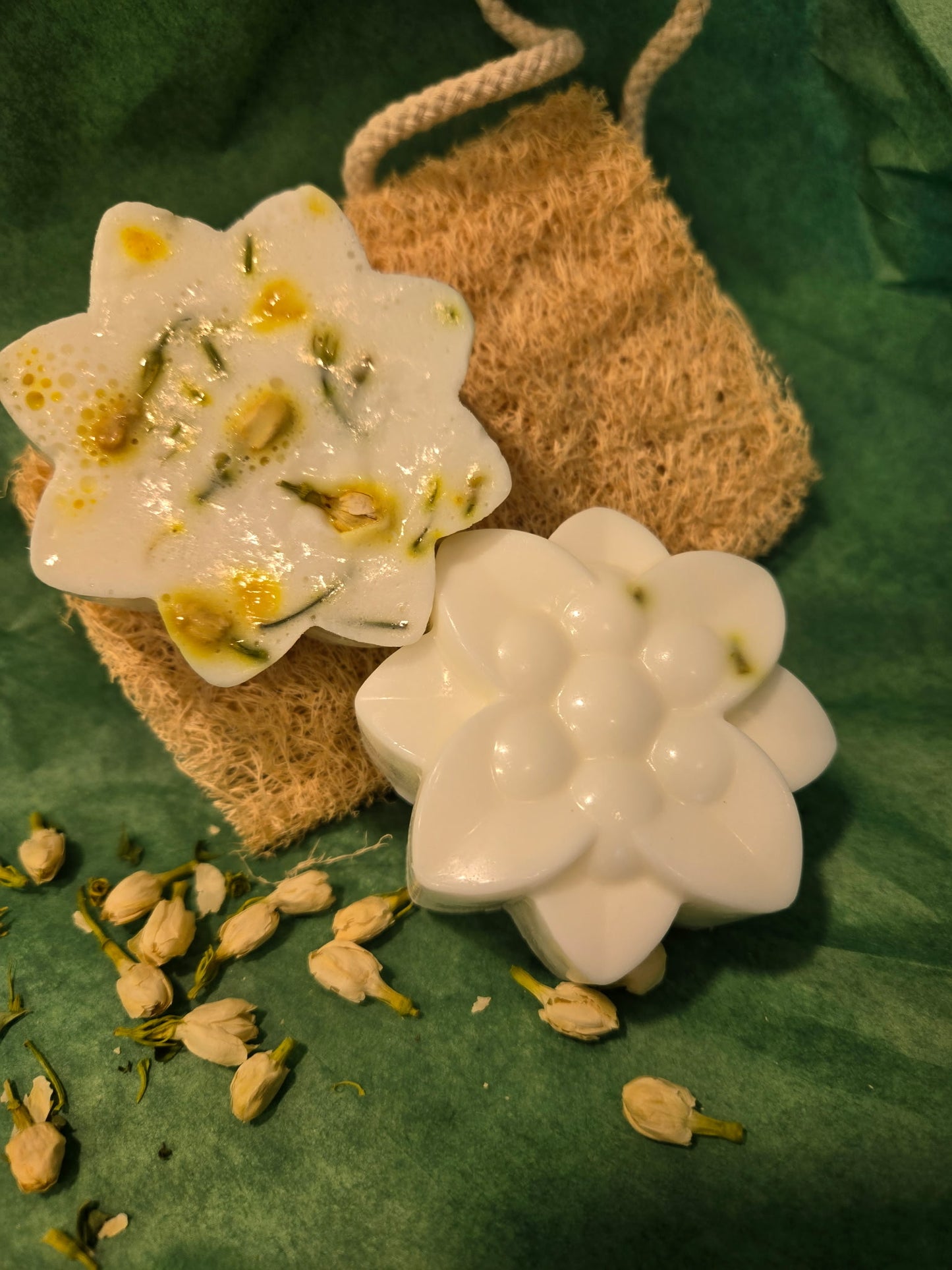 Decorative soap with floral design on a green surface